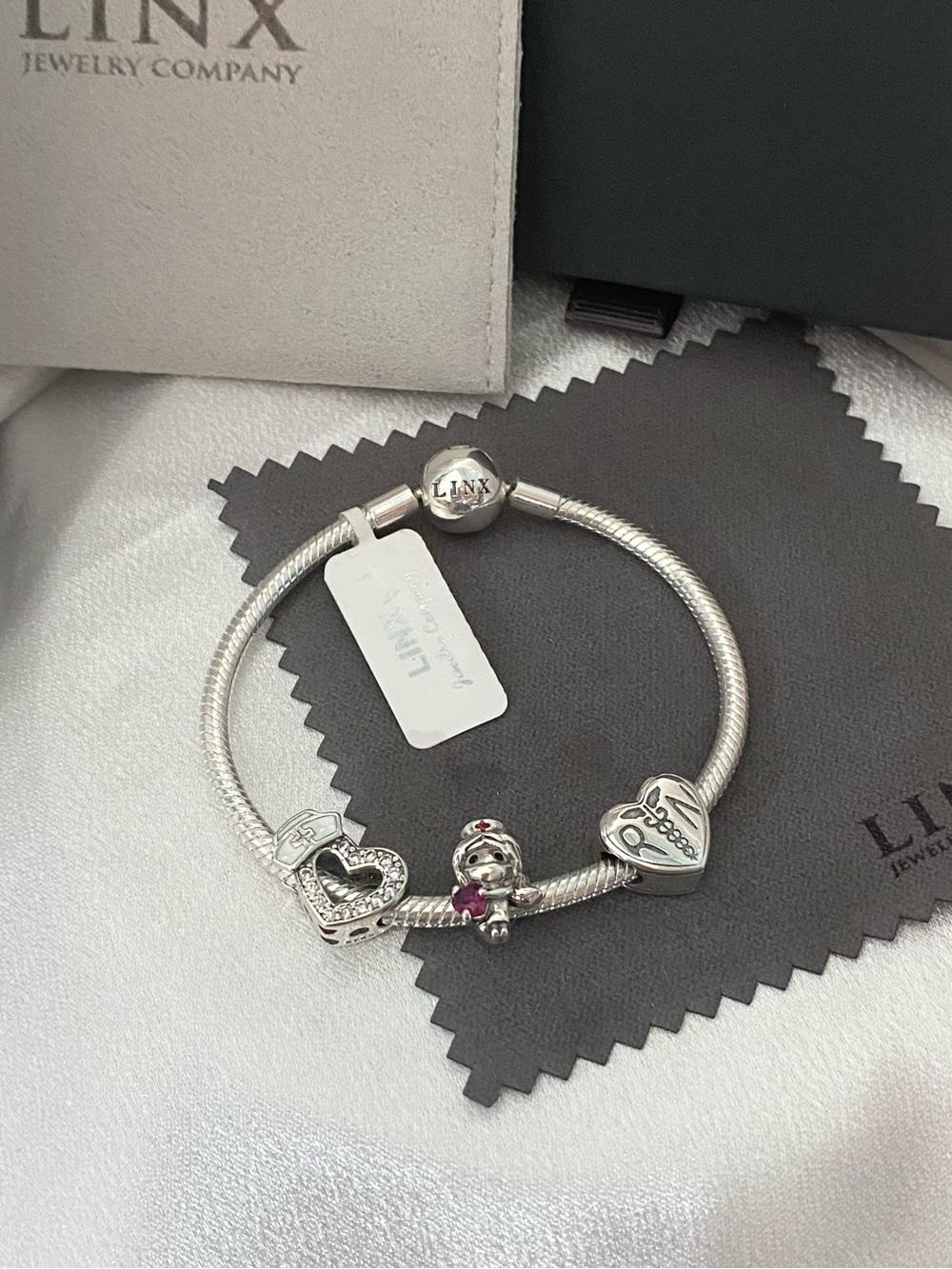 Linx Sterling Silver Snake Chain Bracelet with Registered Nurse Themed Charms
